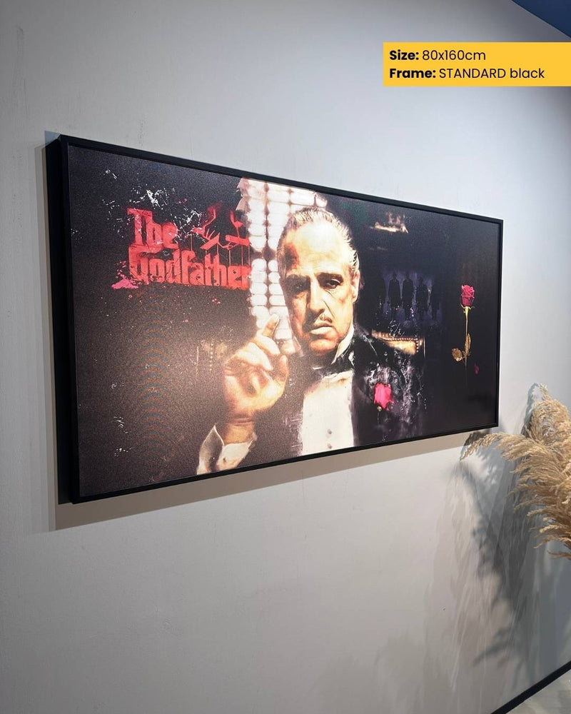 Framed poster of 'The Godfather' on a wall with text about size and frame color.