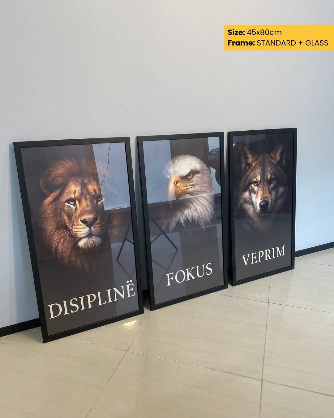 Three framed animal portraits on a wall with text underneath.