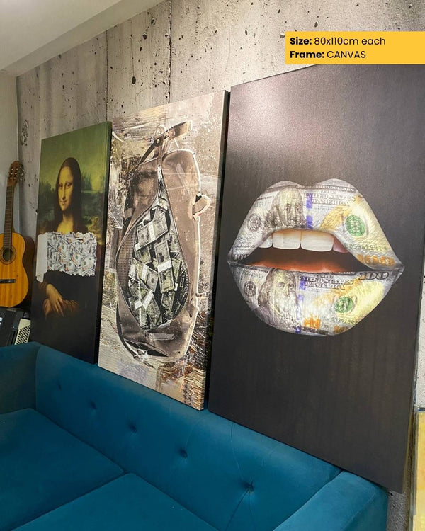 Three artistic canvases on a wall with a blue sofa below.