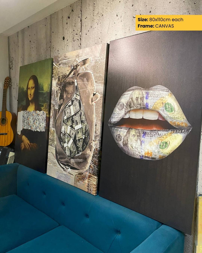 Three artistic canvases on a wall with a blue sofa below.
