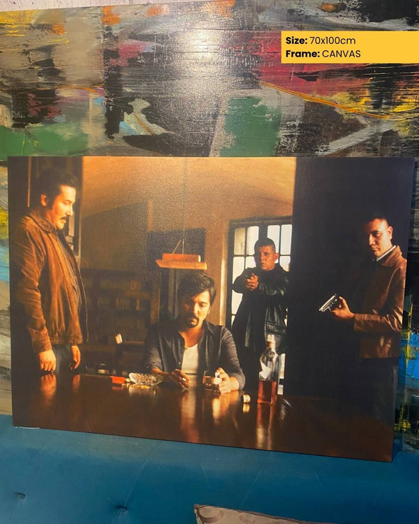 Canvas print of a scene with people around a table, with a colorful abstract background.