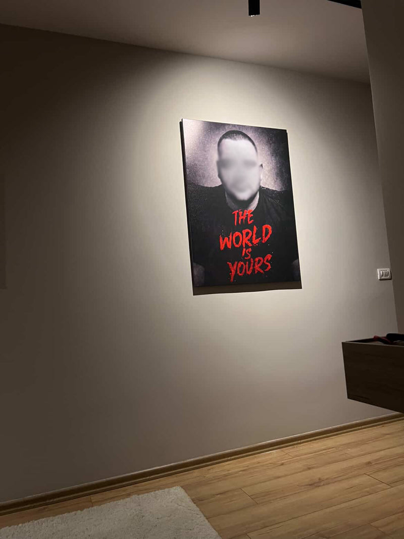 Poster with text on a wall in a dimly lit room