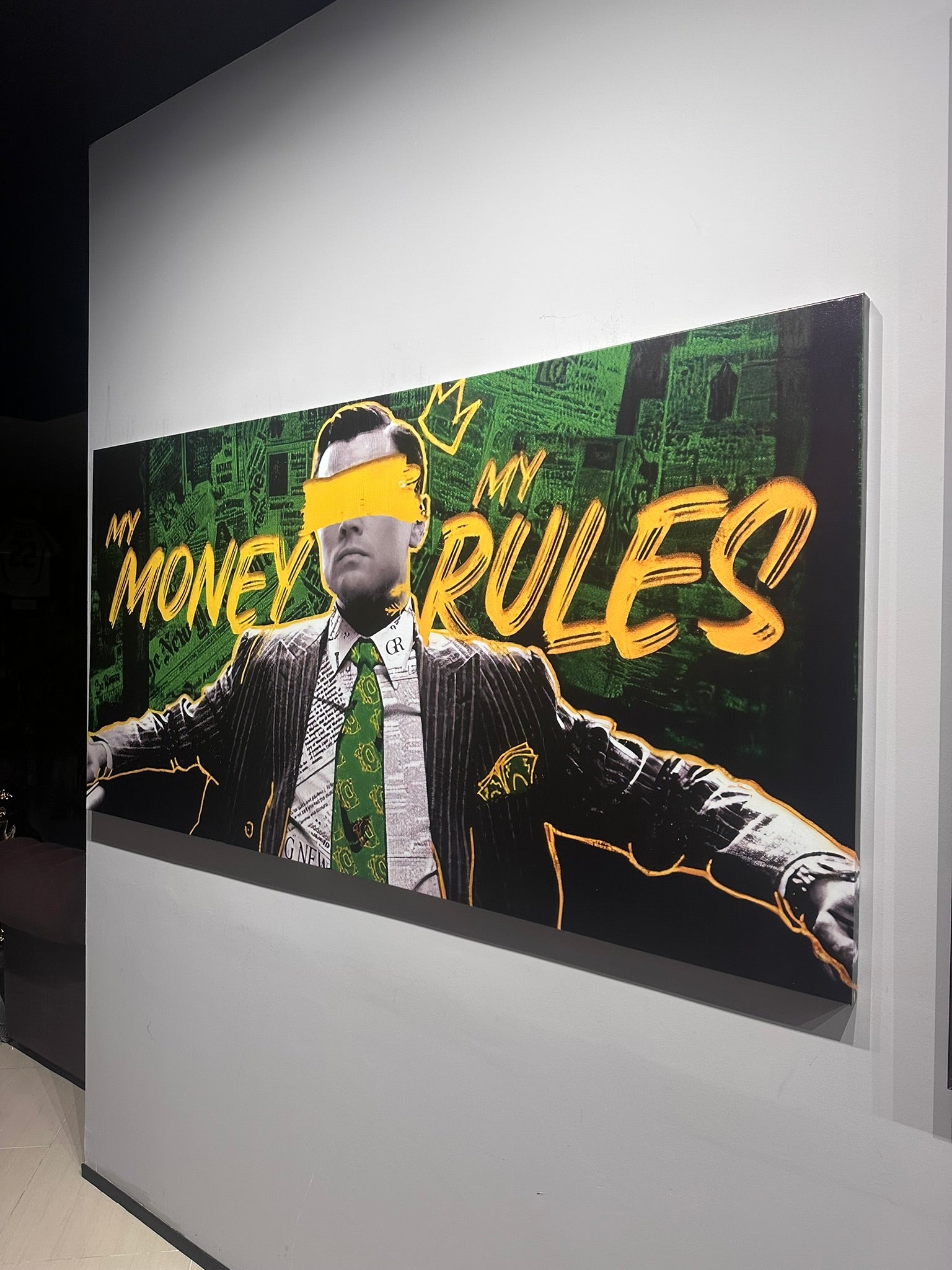 Large poster with a stylized image of a man in a suit and tie, with text 'MY MONEY RULES' on a green and black background.