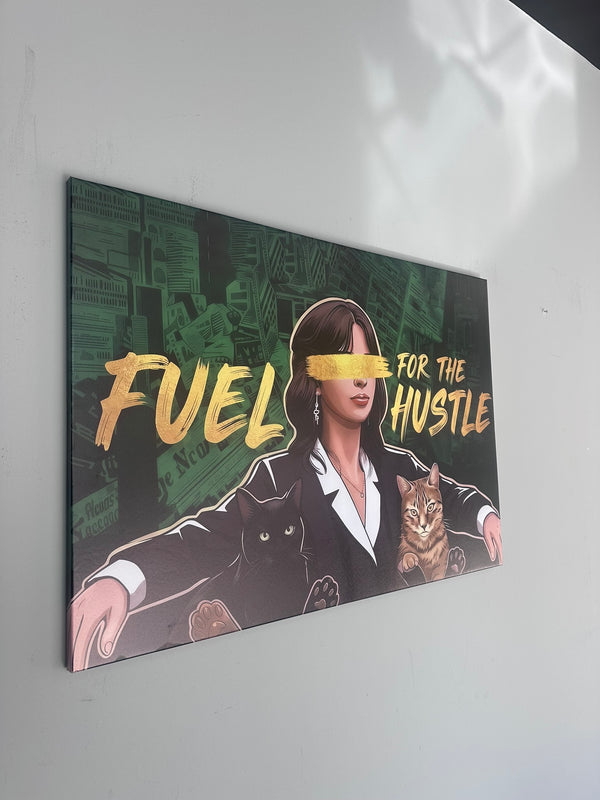 Canvas print with a stylized illustration of a woman, cat, and text 'Fuel for the Hustle' on a dark background.