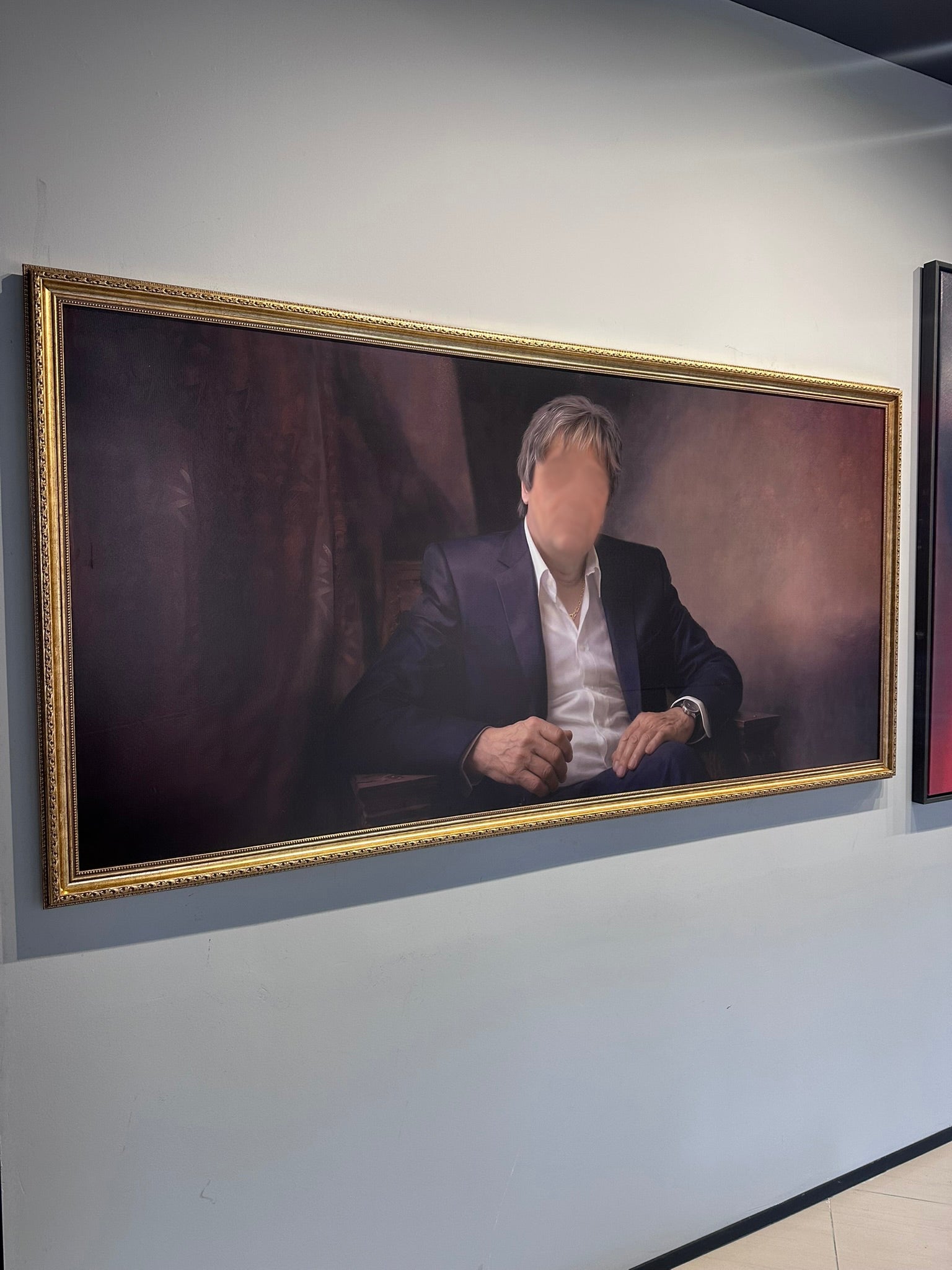 Framed portrait of a person on a wall