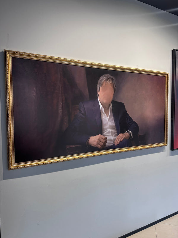 Framed portrait of a person on a wall