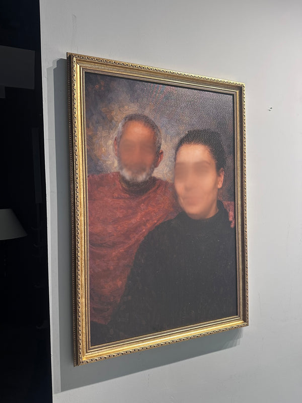 Framed portrait of two people on a wall