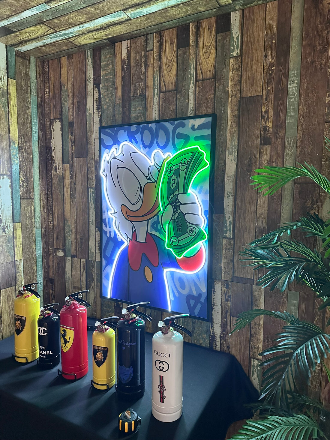 Scrooge Money Stack LED Art with neon dollar bills and luxury graffiti background