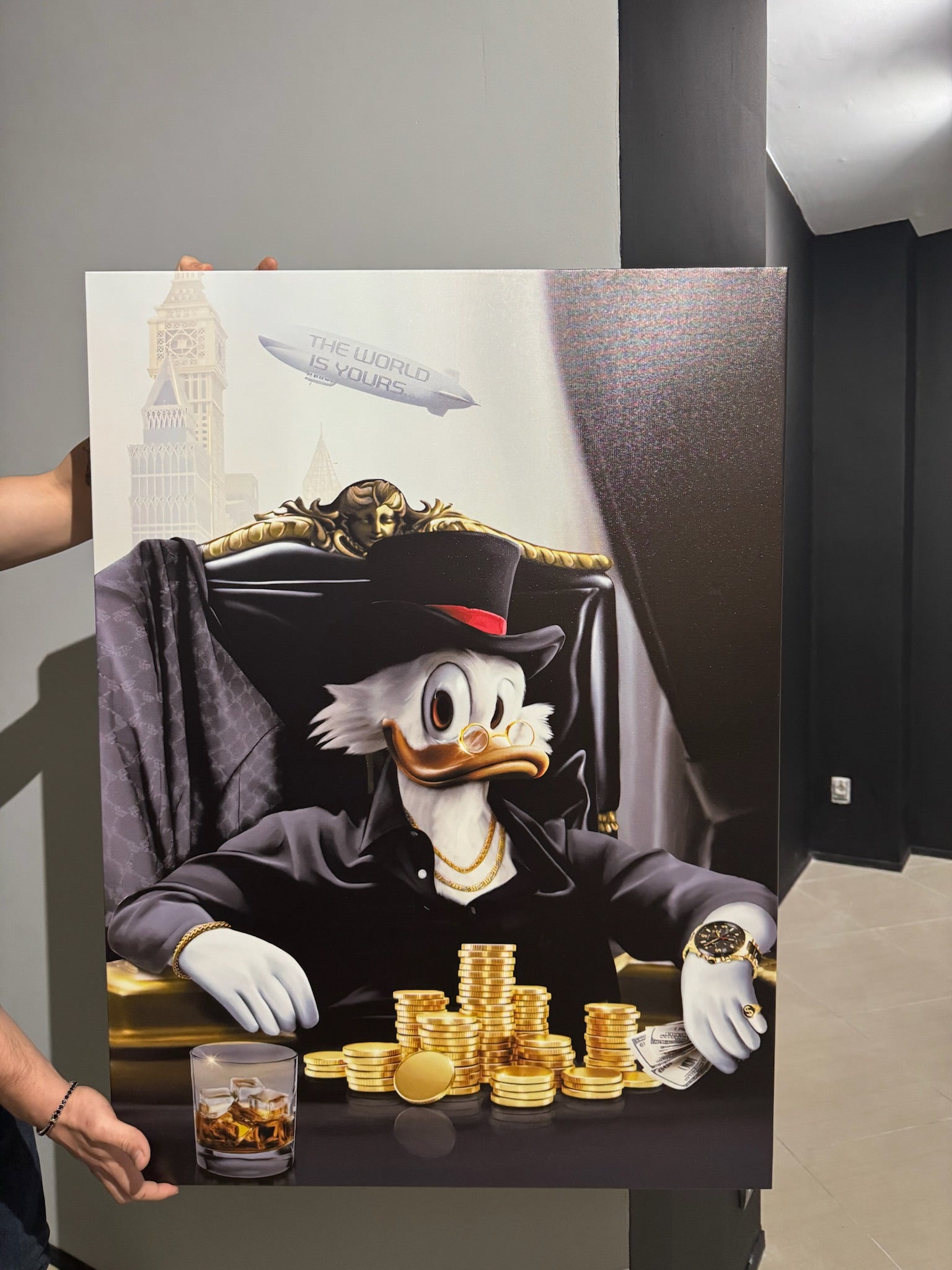 Cartoon character in a suit with gold coins and a glass of whiskey on a table.