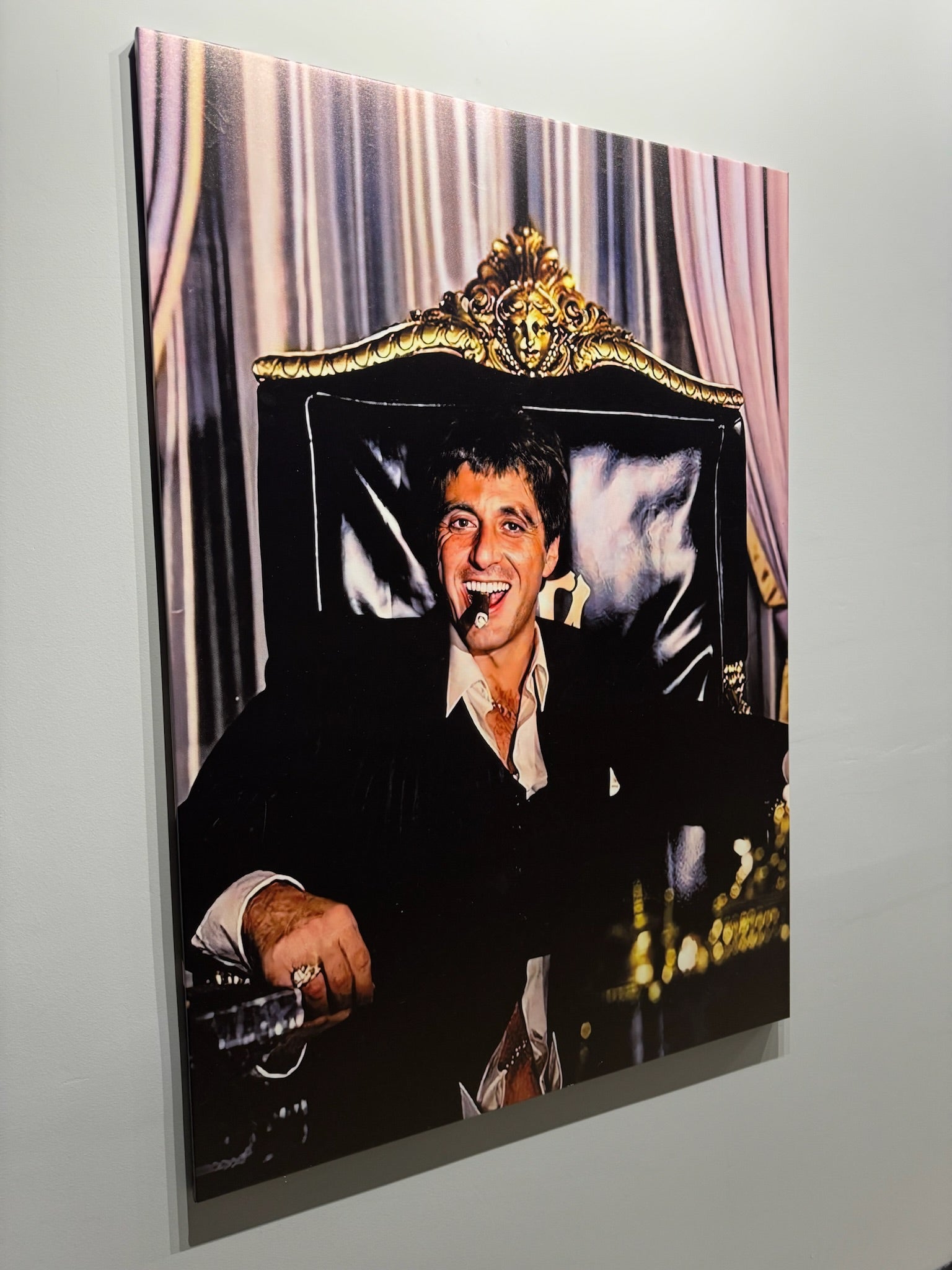 Decorative wall art with a person in formal attire and a decorative headboard.