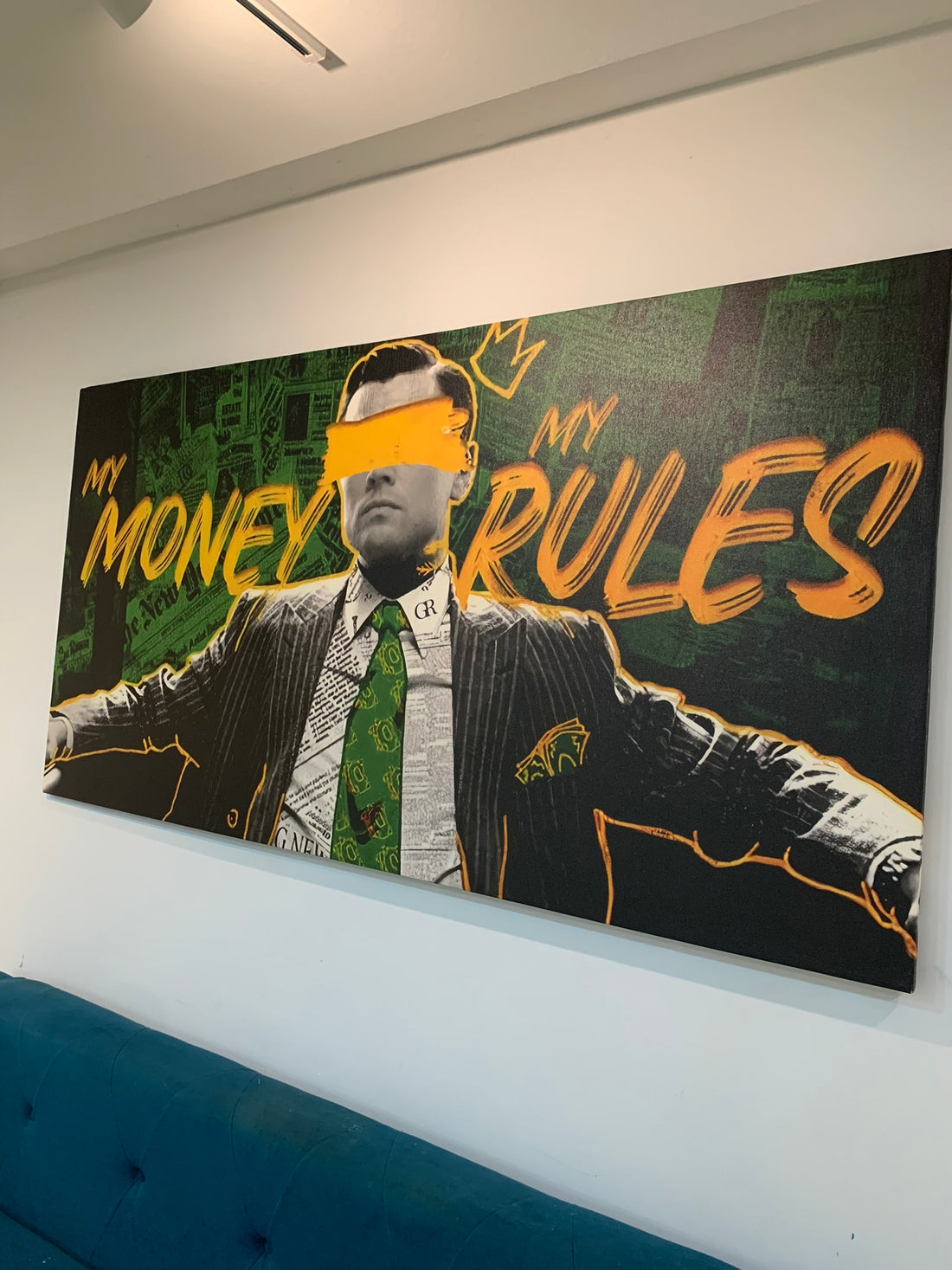 Large poster with a stylized image of a man in a suit and tie, with text 'MY MONEY RULES' on a green and black background.