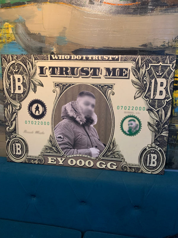 Faux dollar bill with a person's face blurred, placed on a textured surface.