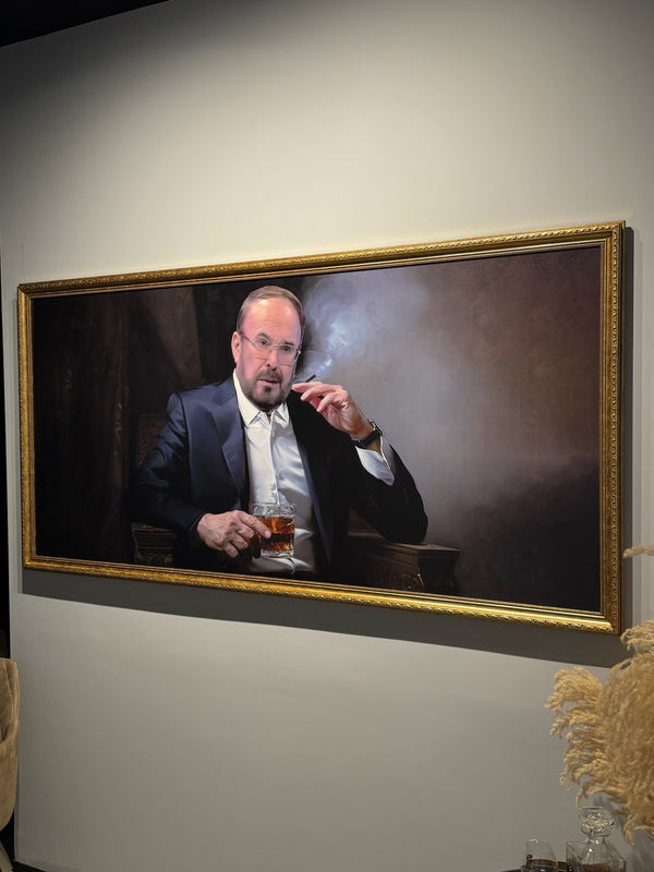 Fatos Nano. Framed portrait of a man smoking a cigarette and holding a drink on a wall.