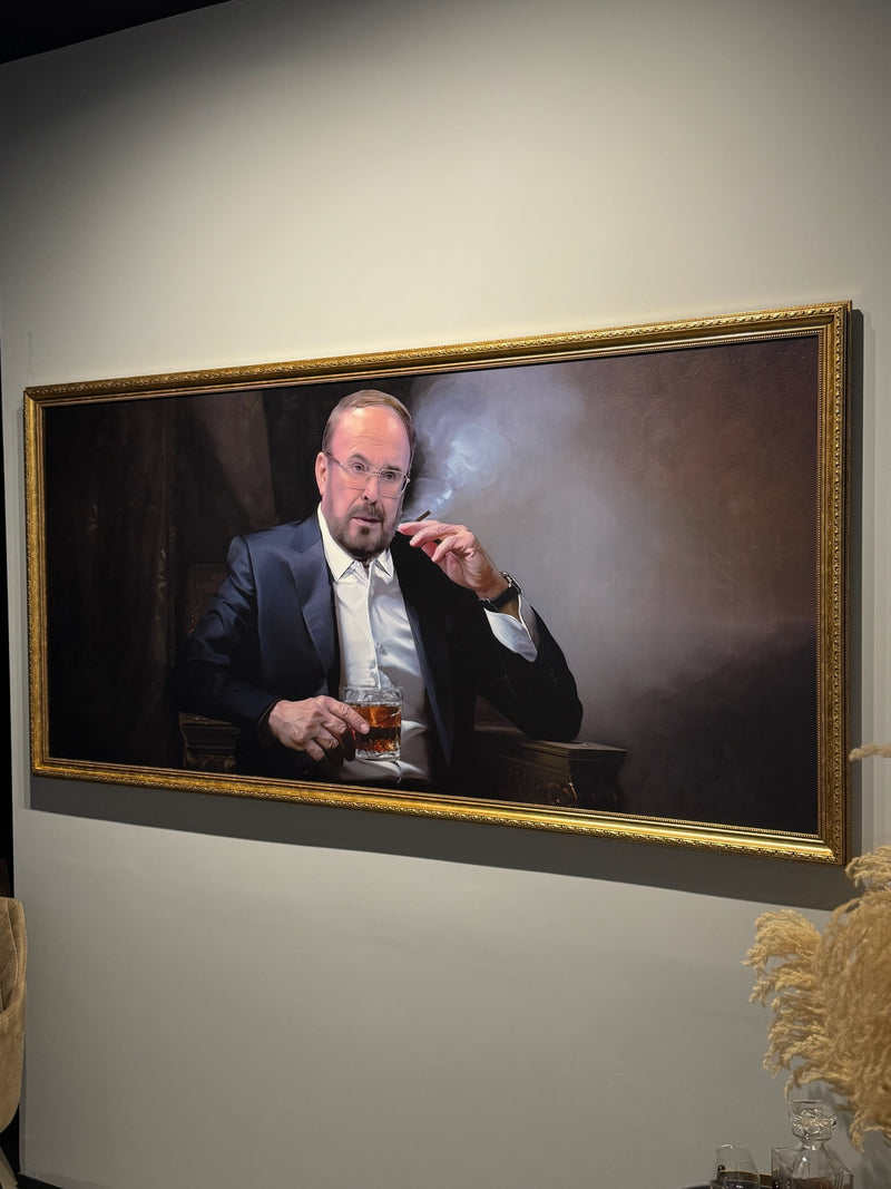 Fatos Nano. Framed portrait of a man smoking a cigarette and holding a drink on a wall.