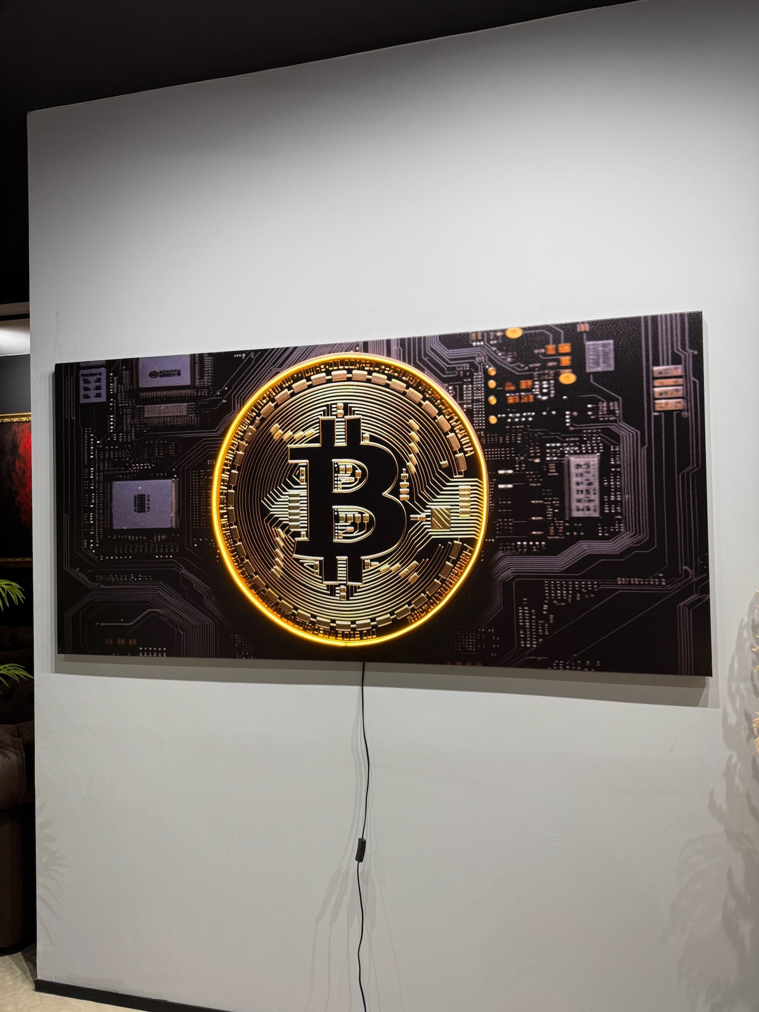 Decorative wall art with Bitcoin symbol on a circuit board design
