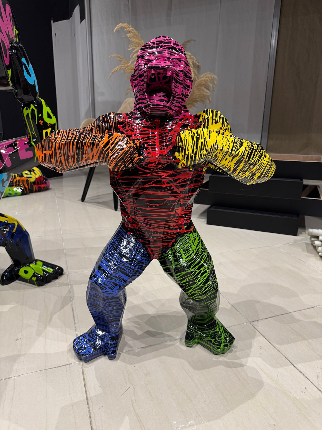 Colorful neon splash gorilla statue with urban graffiti art design by GETRICH