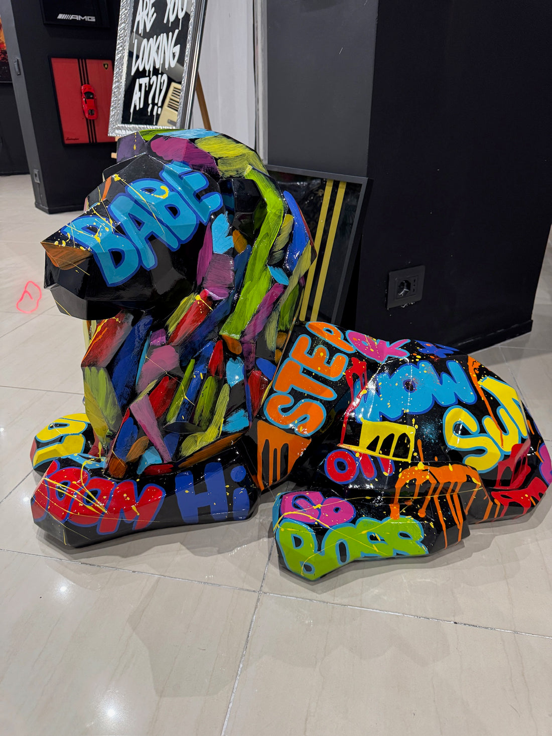 Colorful graffiti lion statue with modern urban art design by GETRICH