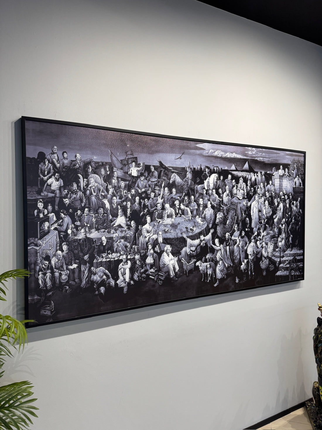 Personazhet e historise Large black and white framed artwork on a wall