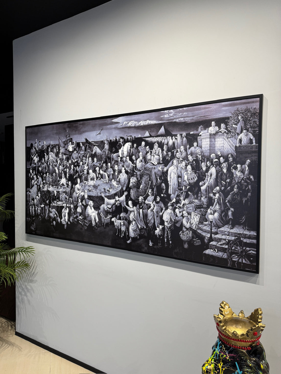 Personazhet e historise Large black and white framed artwork on a wall