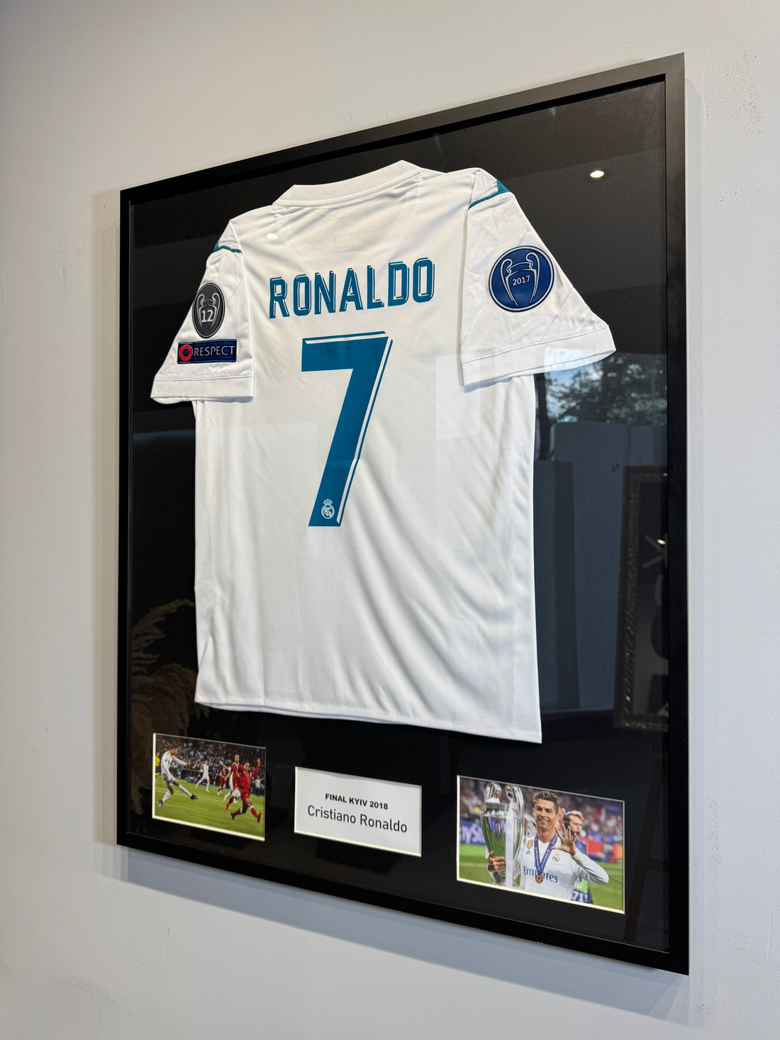Custom football jersey frame with premium glass and player photos
