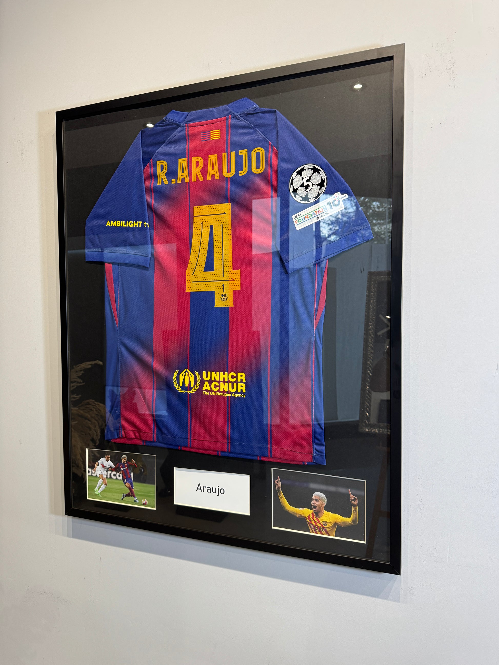 Custom football jersey frame with premium glass and player photos