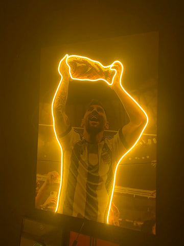 Neon outline of a person holding a bag above their head against a dark background