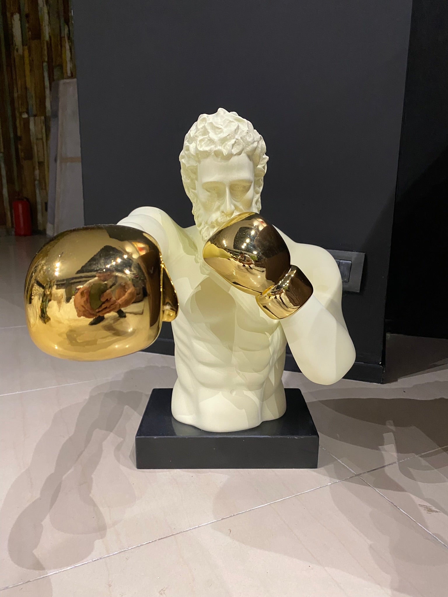 Luxury Boxing Zeus statue with gold boxing gloves and modern premium design by GETRICH