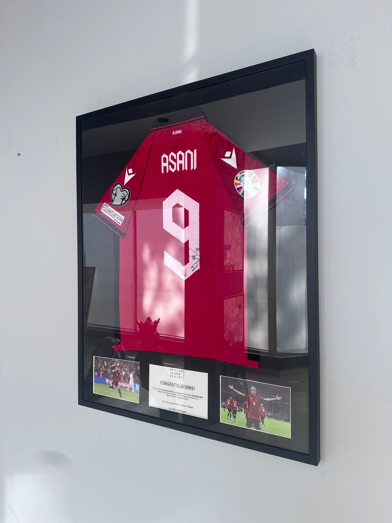 Custom football jersey frame with premium glass and player photos