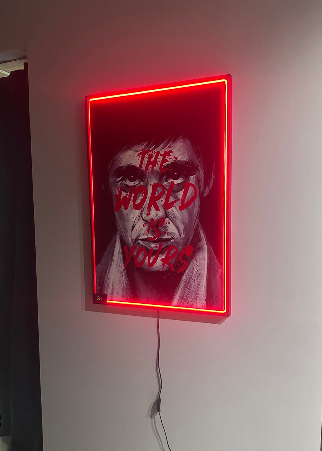 Neon sign with a graphic design on a wall