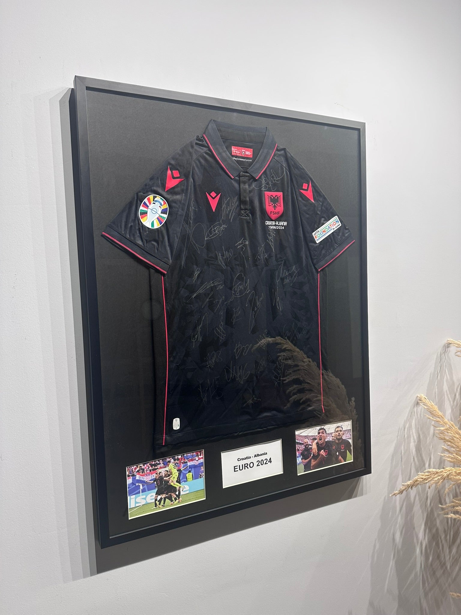 Custom football jersey frame with premium glass and player photos