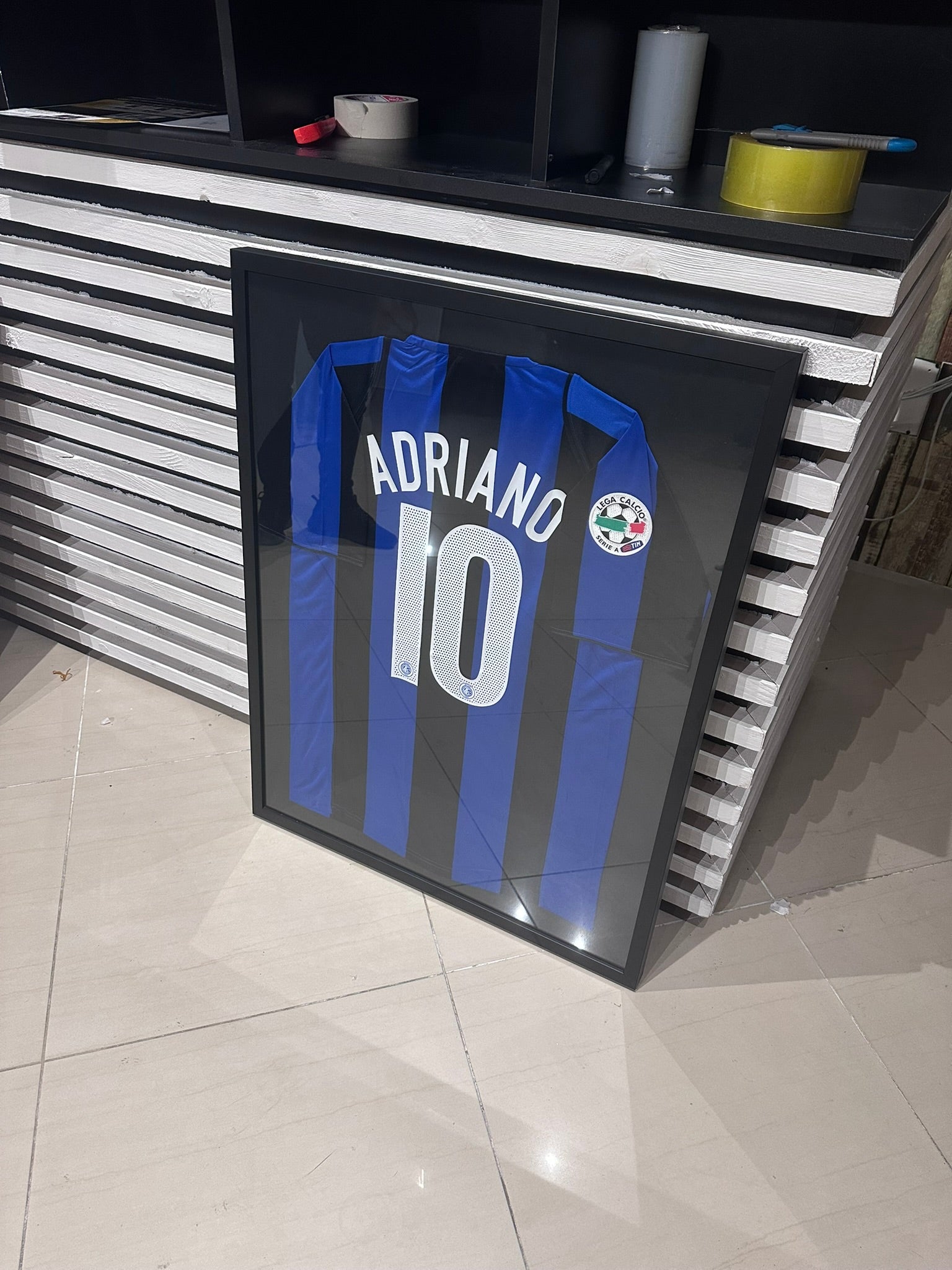 Custom football jersey frame with premium glass and player photos