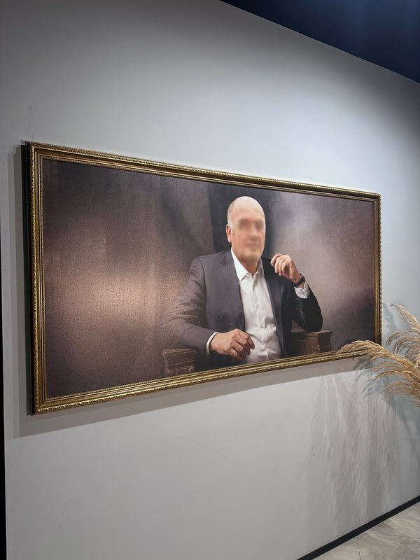 Framed portrait of a man in a suit on a wall