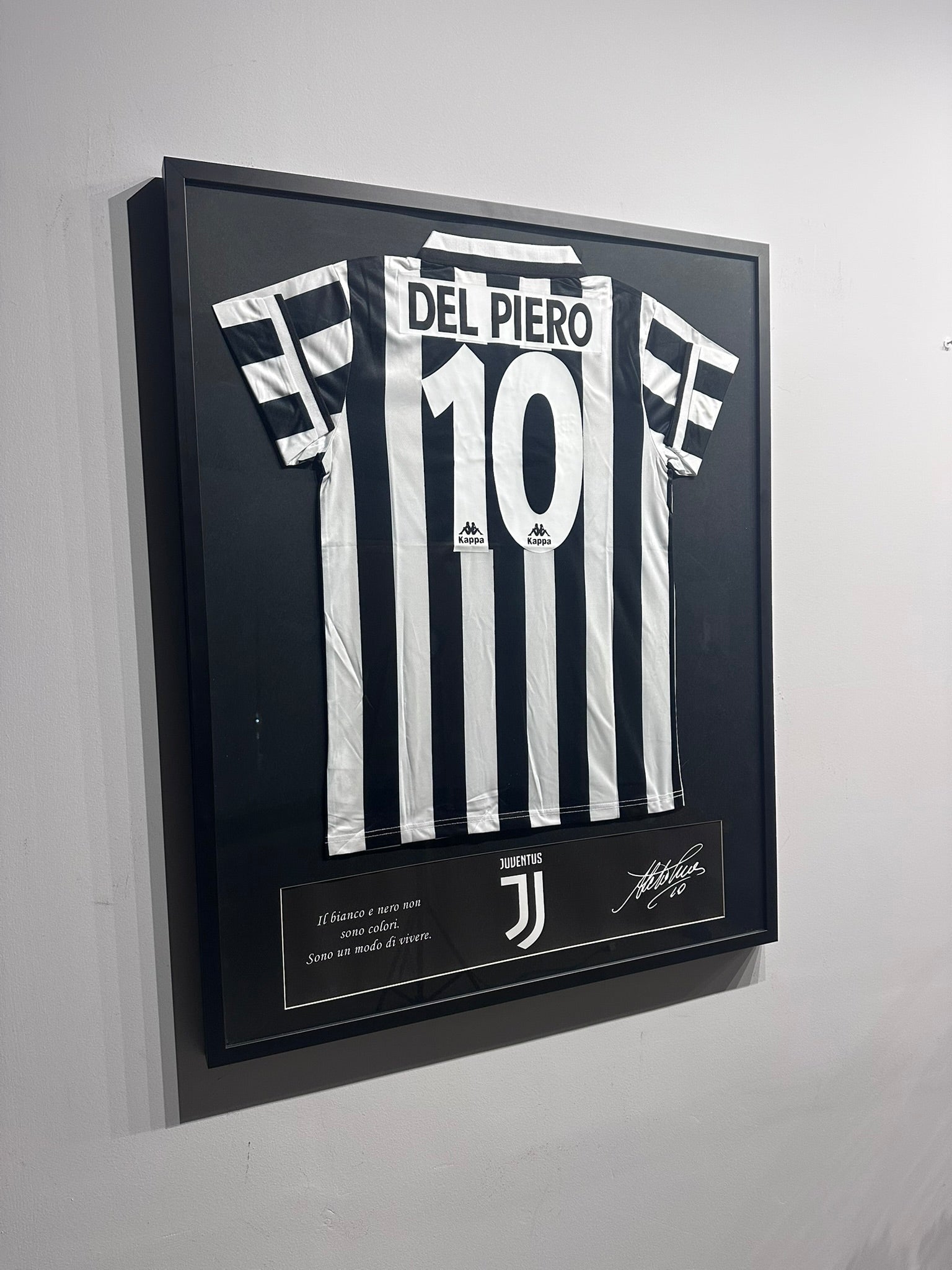 Custom football jersey frame with premium glass and player photos