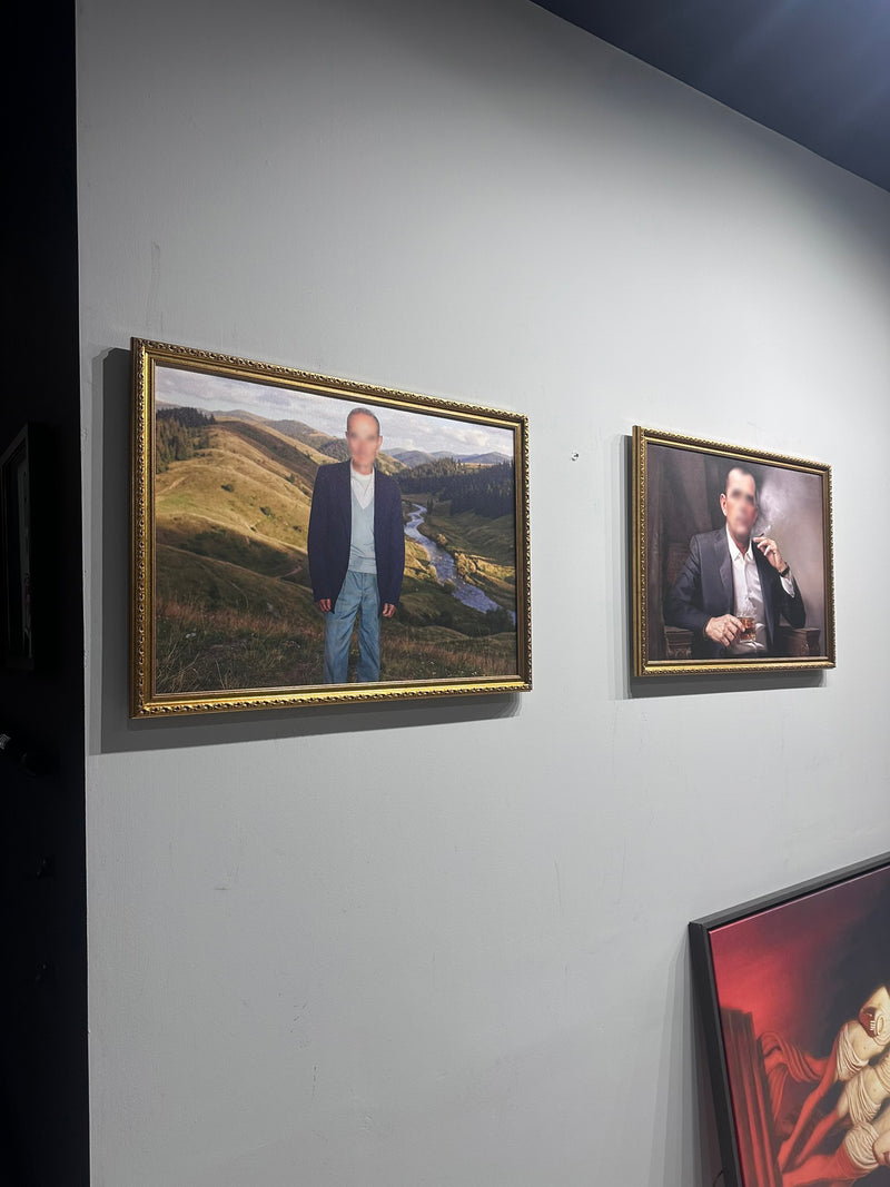 Two framed portraits on a wall with a neutral background