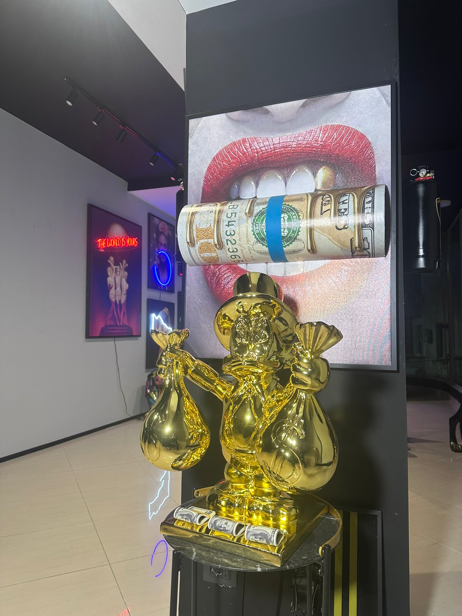 Gold rich duck statue holding money bags luxury decor by GETRICH