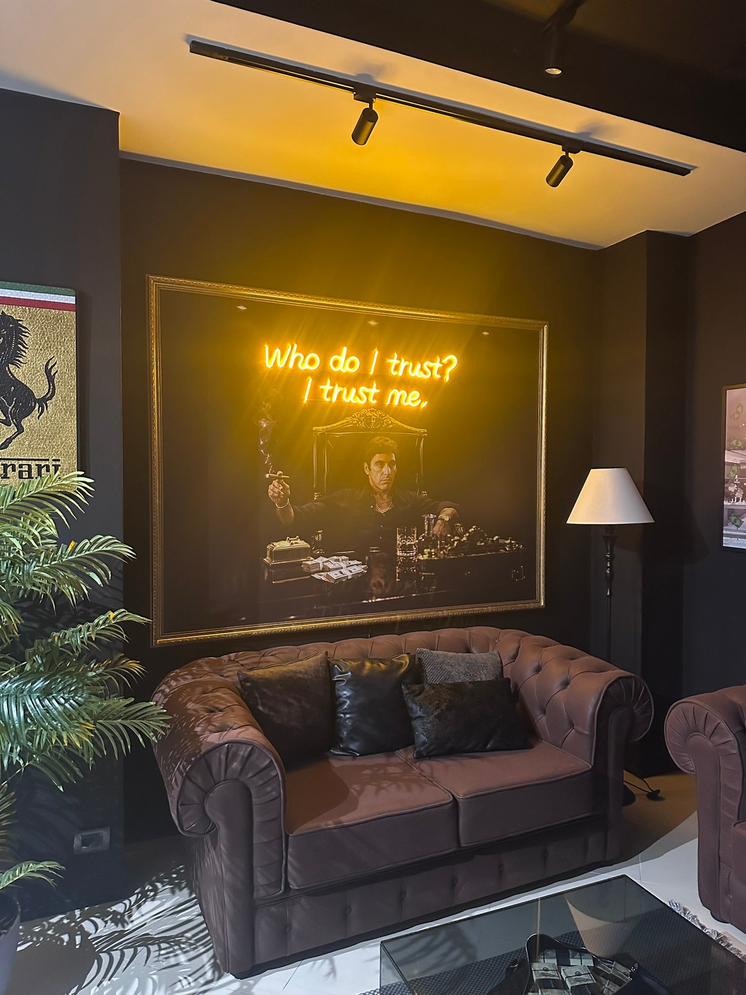Neon sign on a wall with a quote in a modern living room setting.